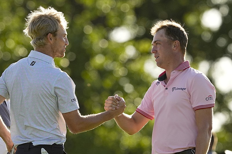 Justin Thomas is greeted by Will Zalatoris after winning the PGA Championship golf tournament in a playoff over Zalatoris at Southern Hills Country Club Sunday in Tulsa, Okla. - Photo by Matt York of The Associated Press