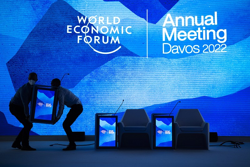 Workers set the stage prior to the annual meeting of the World Economic Forum, in Davos, Switzerland, Sunday, May 22, 2022. (Gian Ehrenzeller/Keystone via AP)