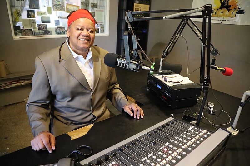 Ras Levi taps the Book of Reggae for his long-running weekly KABF broadcast “One Love Reggae Party.” Levi is a foremost authority on what he calls “a unique type of music that brings so many different people together.” (Special to the Democrat-Gazette/Dwain Hebda)