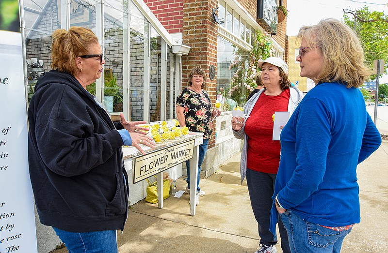 Monday, May 23, 2022, was the Parents' Day of Hope at Busch's Florist during which parents who've lost a child can meet with others and find support in the gathering. Peggy Talken, at left, and Sheila Singer, at right, visit with Jacqueline Walker, who attended for the first time Monday. In the background is Susan Gleason, also a first time attendee to the 5th annual outreach event. The gathering is sponsored by Busch's Florist in conjunction with Steel Magnolias Mommas and Just for Dad's support groups. Gleason lost her son in 2020 while Singer lost a young son to cancer in 1991. Talken's daughter Corrie was killed in a boating accident in 2014 and Walker's daughter was killed in a car wreck in 1989. (Julie Smith/News Tribune photo)