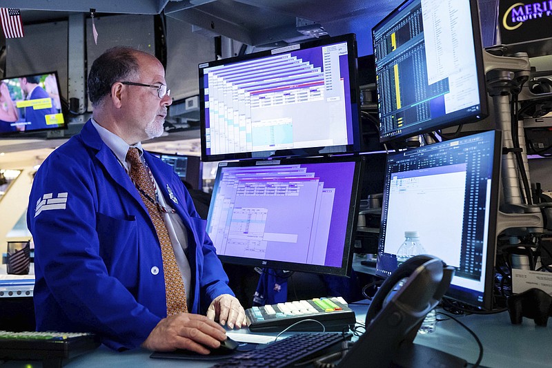 In this photo provided by the New York Stock Exchange, specialist Douglas Johnson works on the trading floor, Monday, May 23, 2022. Stocks rallied in afternoon trading on Wall Street Monday following seven weeks of declines that nearly ended the bull market that began in March 2020. (David L. Nemec/New York Stock Exchange via AP)