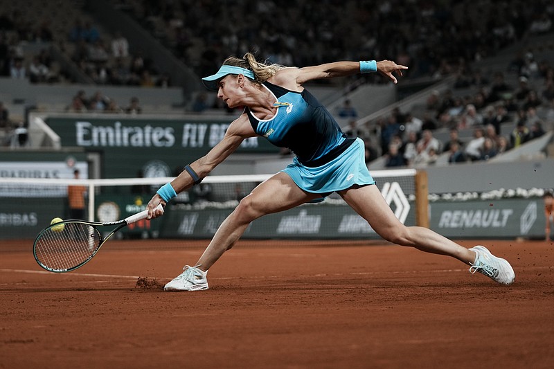 Ukraine's Lesia Tsurenko plays a shot against Poland's Iga Swiatek during their first round match at the French Open in Roland Garros stadium in Paris, France, Monday. - Photo by Thibault Camus of The Associated Press