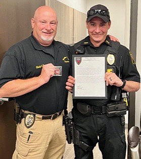 Submitted Photo
Officer Braxton Handle grins proudly as he displays the letter of commendation he received from Gravette police chief Chuck Skaggs, honoring him for the way he took over and handled a pursuit through several towns in March. Officer Handle did an "outstanding job," Chief Skaggs said.