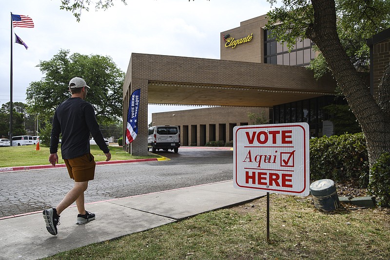 Eli Hartman/Odessa American via AP
Voter Austin Hall walks into a polling location to cast his vote in the joint primary runoff election on Tuesday in Odessa, Texas.