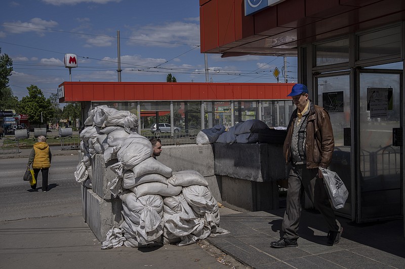 A man walks out of the subway in Kharkiv, eastern Ukraine, Tuesday, May 24, 2022. Kharkiv subway resumed service on Tuesday morning after it was closed for more than two months during Russian attempt to capture the city. (AP Photo/Bernat Armangue)