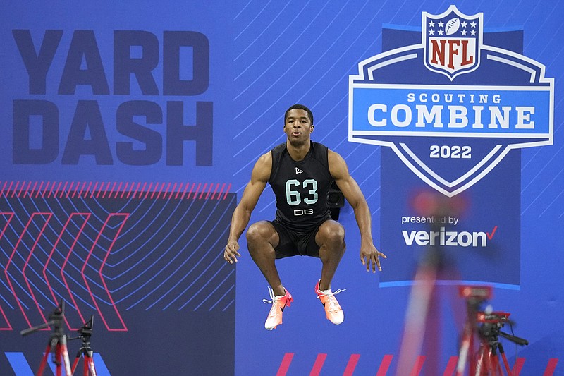 FILE - Baylor defensive back JT Woods prepares to run the 40-yard dash at the NFL football scouting combine, Sunday, March 6, 2022, in Indianapolis. Indianapolis will be keeping the NFL scouting combine for the next two years. At the owners meetings in Atlanta on Tuesday, May 24, 2022, the city that has staged the winter event since 1987 for players entering the draft was granted hosting rights for 2023 and 2024. This was the first time the NFL put the combine up for bidding, with Dallas and Los Angeles also seeking to hold the combine. (AP Photo/Charlie Neibergall, File)