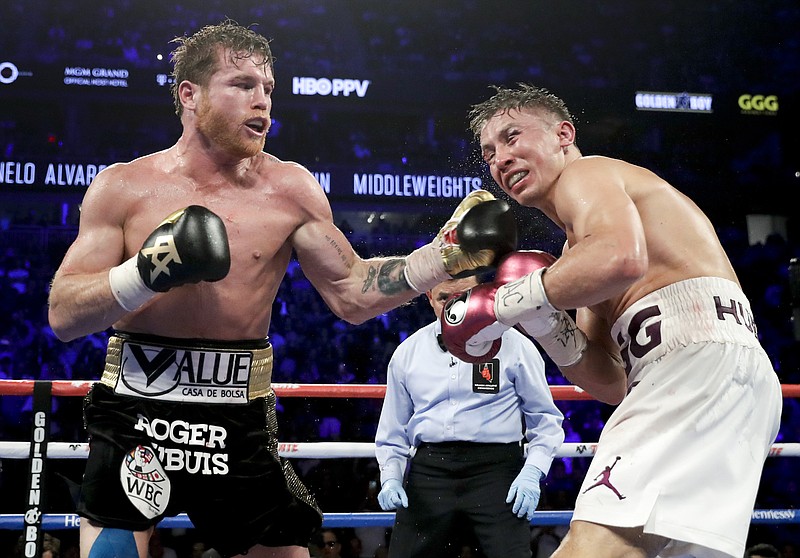 FILE - Canelo Álvarez lands a punch against Gennadiy Golovkin in the 12th round during a middleweight title boxing match, Saturday, Sept. 15, 2018, in Las Vegas. Alvarez won by majority decision. Álvarez and Golovkin will resume their rivalry Sept. 17 after a four-year break, promoter Matchroom announced Tuesday, May 24, 2022. (AP Photo/Isaac Brekken, File)