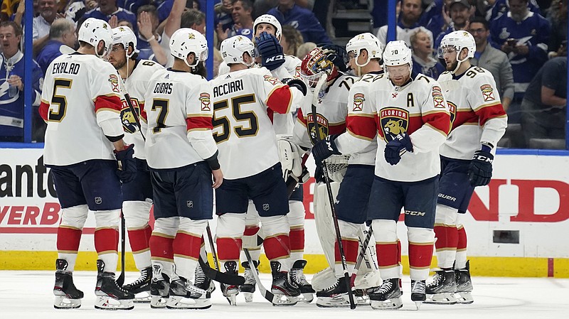 Florida Panthers players consol goaltender Sergei Bobrovsky (72) after the Tampa Bay Lightning eliminated the Panthers during Game 4 of an NHL hockey second-round playoff series Monday, May 23, 2022, in Tampa, Fla. (AP Photo/Chris O'Meara)