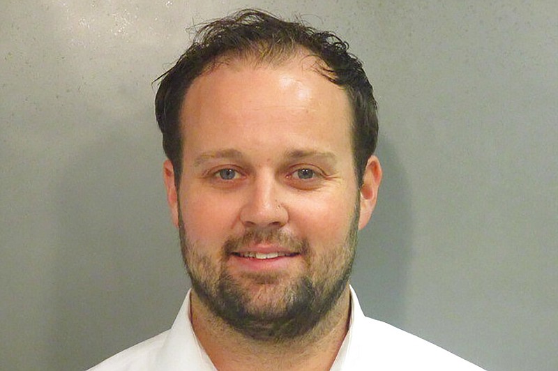 This undated photo provided by Washington County (Ark), Detention Center shows Josh Duggar. The former reality TV star is returning to federal court in Arkansas, where a judge could sentence him to up to 20 years in prison for receiving and possessing child pornography. Prosecutors on Wednesday, May 25, 2022 are seeking a maximum sentence for Duggar, whose large family was the focus of TLC&#x2019;s &#x201c;19 Kids and Counting&#x201d; reality show. (Washington County Detention Center via AP)