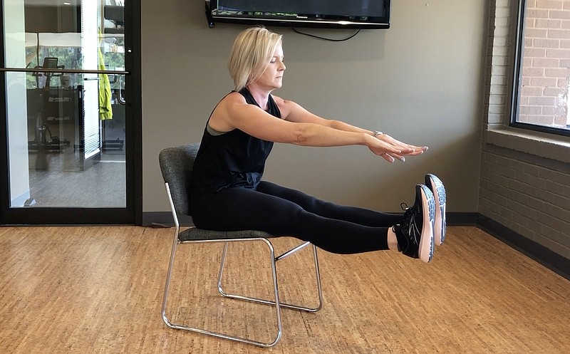 Registered yoga teacher Natalie Staley demonstrates the Floating Hamstring Stretch at Little Rock Racquet Club for Matt Parrott's Master Class. (Arkansas Democrat-Gazette/Celia Storey)