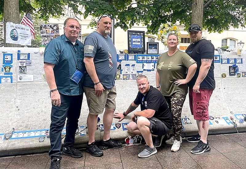 Courtesy photo Several Pea Ridge Police Department officers and their family members went to Washington, D.C., for the National Police Week events. Shown in front of the Memorial Wall, on which former Pea Ridge Police Officer Kevin Apple’s name was placed, are (from left) Lynn Hahn, Todd Cornwell, Justin Lawson, Mindy Fowler and Rich Fordham.