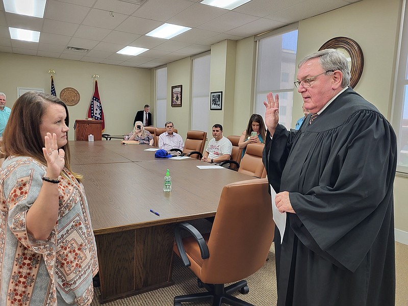 Lexie Kelley is sworn into the office of Union County Treasurer by Judge Hamilton Singleton on Thursday, May 26. She will fill out the remainder of retired Treasurer Debbie Ray's term, which ends Dec. 31. (Caitlan Butler/News-Times)