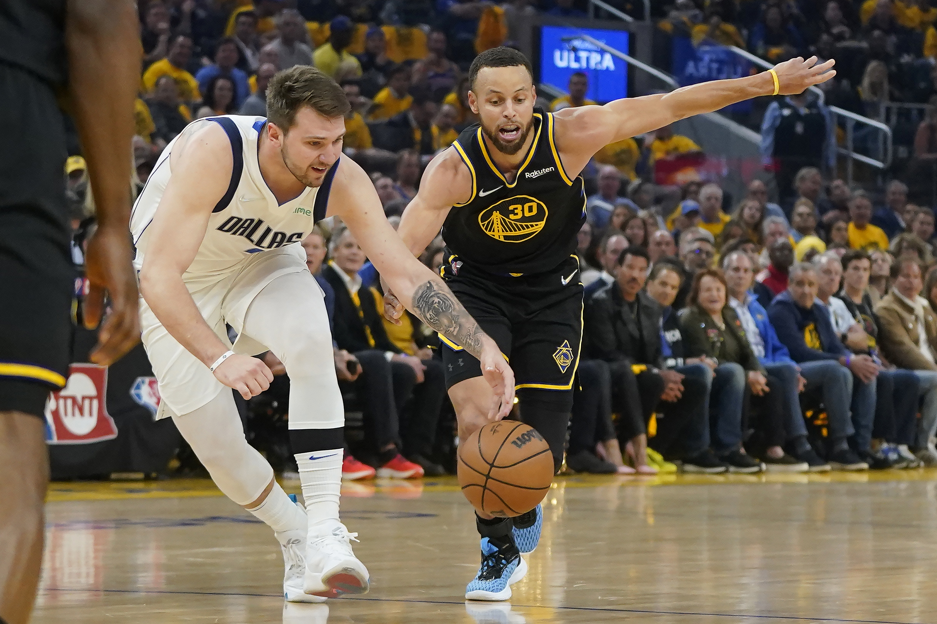 The Golden State Warriors' Nemanja Bjelica (8) guards against the Dallas  Mavericks' Luka Doncic (77) in the fourth quarter of Game 4 of their NBA  Western Conference finals playoff game at the