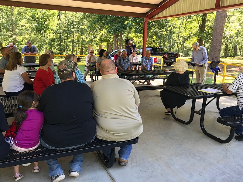 About 70 Miller County residents and officials gather Friday, May 27, 2022, at Alex Smith Park in Miller County for the dedication of two pavilions. The pavilions honor Miller County jailer Lisa Mauldin and sheriff's Deputy Charles Barnes, who lost their lives in the line of duty. Parks Committee Member Bill Pointer officiated at the dedication. County resident Alex Smith donated 320 acres in 1962 to form the park. Today, Smith Park also has a pollination garden and a gun range. Two more pavilions also are in the works. (Staff photo Greg Bischof)