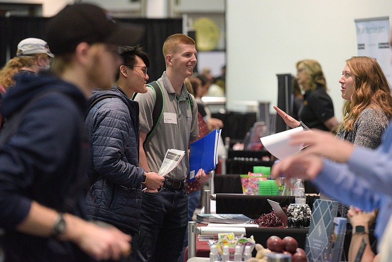 Students and exhibitors meet on Thursday, March 3, 2022, at an all-majors career fair inside the Reynolds Room of the Smith-Pendergraft Campus Center at the University of Arkansas-Fort Smith in Fort Smith. (NWA Democrat-Gazette/Hank Layton)
