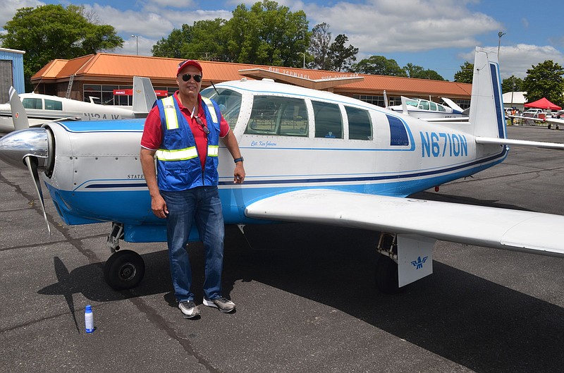 Ken Johnson, chairman of the Pine Bluff Aviation Commission, shows off his pristine-condition Mooney built in Kerrville, Texas, in 1966. It was the fastest single-engine, retractable landing gear aircraft of its day. (Special to The Commercial/Richard Ledbetter)