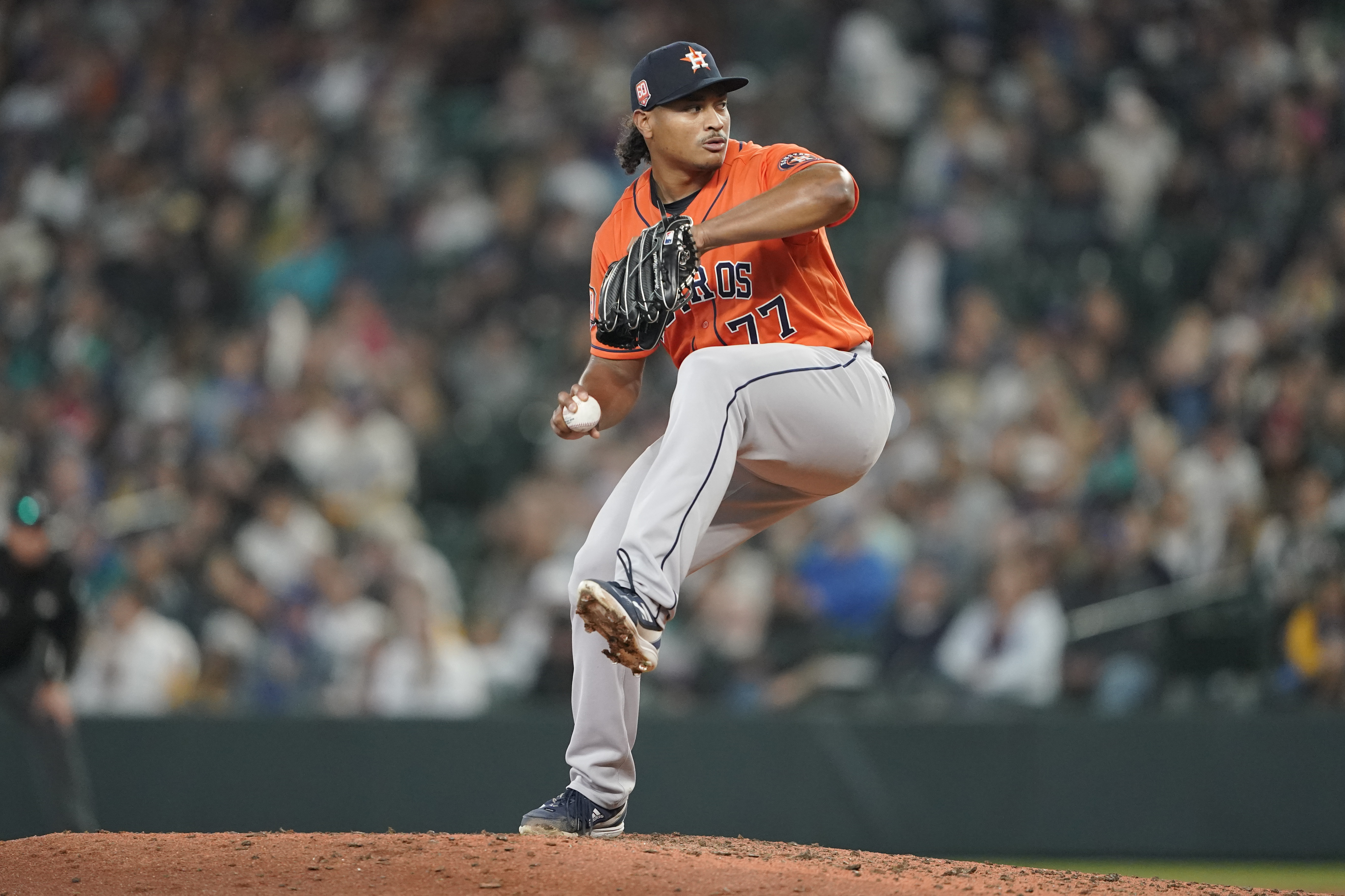 May 6 2022: Houston pitcher Luis Garcia (77) throws to first