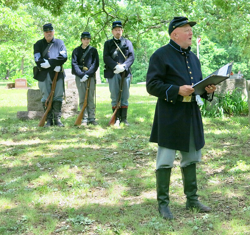 Westside Eagle Observer/SUSAN HOLLAND
Joe Rainey, commander of McPherson Camp #1, Sons of Union Veterans of the Civil War in Rogers, welcomes visitors to the Memorial Day observance at the GAR Cemetery in Sulphur Springs, Monday afternoon, May 30. Rainey opened the ceremony by reading the Americans Creed, then told a bit about the history of the GAR.