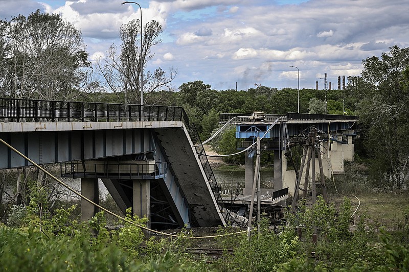 The destroyed bridge connecting the city of Lysychansk with the city of Severodonetsk in the eastern Ukranian region of Donbass, amid Russian invasion of Ukraine, on Sunday, May 22, 2022. (Aris Messinis/AFP/Getty Images/TNS)