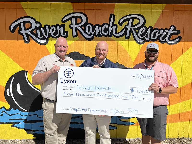ALEXUS UNDERWOOD/SPECIAL TO MCDONALD COUNTY PRESS Ronnie Patterson, Tyson plant manager, Jack Kelley, Tyson complex manager, and Dustin Shurback, River Ranch Resort owner, displaying amount donated from Tyson. Shurback's day camp will start this summer with Shurback hoping the camp can be offered annually.