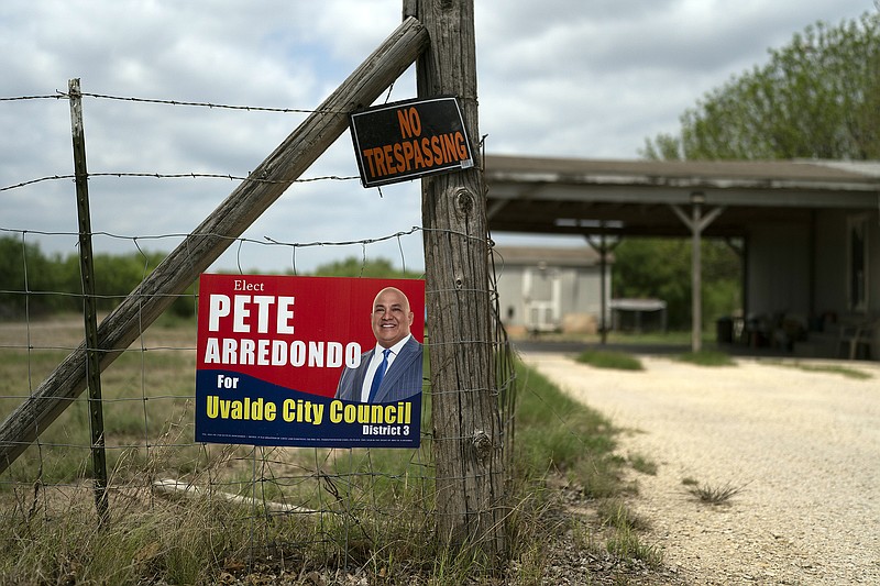 A campaign sign for Pete Arredondo, the chief of police for the Uvalde Consolidated Independent School District, is seen in Uvalde, Texas, Monday, May 30, 2022. (AP Photo/Jae C. Hong)