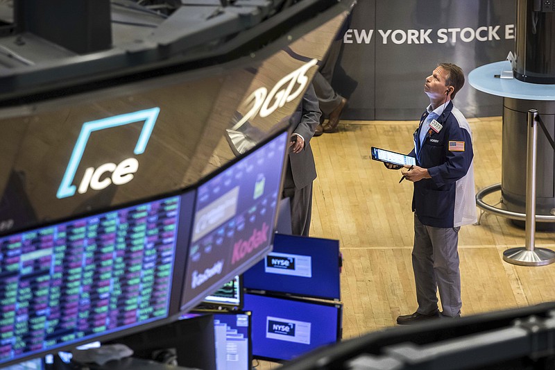 In this photo provided by the New York Stock Exchange, trader Robert Charmak works on the floor, Wednesday, June 1, 2022. Stocks were moderately lower in midday trading Wednesday after a stronger-than-expected report on manufacturing showed that it's likely the Federal Reserve will continue to aggressively raise interest rates to slow down the economy and tame inflation. (Courtney Crow/New York Stock Exchange via AP)