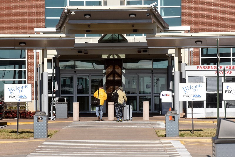 Passengers head for Thanksgiving Day flights on Nov. 25 at Northwest Arkansas National Airport.
(NWA Democrat-Gazette/Flip Putthoff)