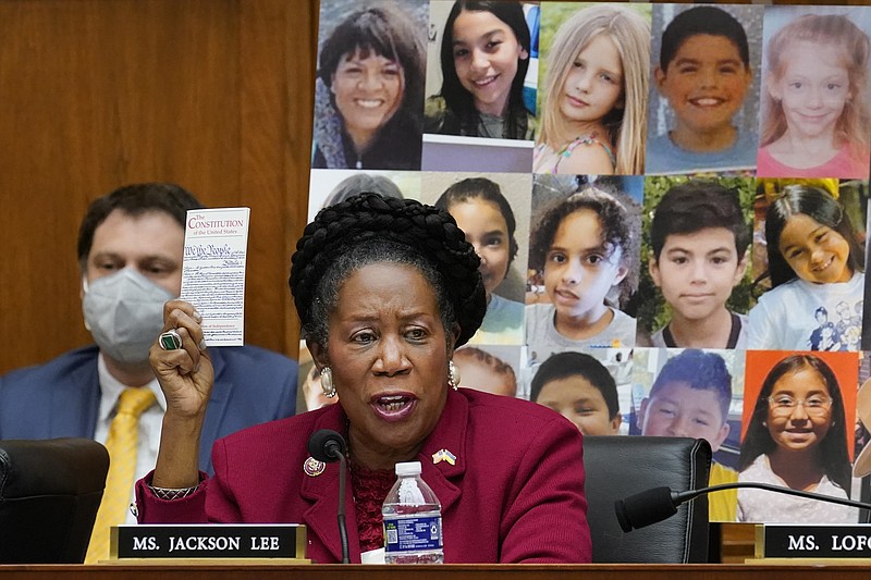 With photos of the young victims in Uvalde, Texas, behind her, Rep. Sheila Jackson Lee, D-Texas, speaks in support of Democratic gun control measures, called the Protecting Our Kids Act, in response to mass shootings in Texas and New York, at the Capitol in Washington, Thursday, June 2, 2022. (AP Photo/J. Scott Applewhite)