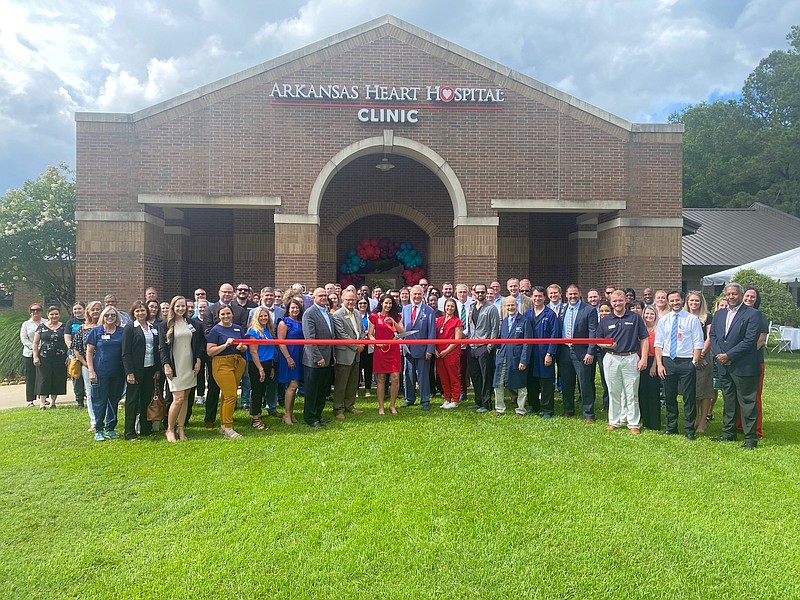 Members of the community gather for the ribbon cutting during a grand opening of Arkansas Heart Hospital's cardiology clinic Thursday, June 2, 2022, in Texarkana, Texas. (Staff photo by Andrew Bell)