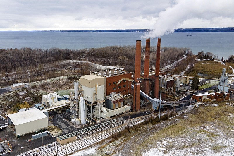 FILE - The Greenidge Generation bitcoin mining facility, in a former coal plant by Seneca Lake in Dresden, New York, is shown in this photo from Nov. 29, 2021. A milestone measure that would tap the brakes on the spread of cryptocurrency mining operations burning fossil fuels in New York has passed the state Legislature. The bill approved early Friday, June 3, 2022, by the state Senate would establish a two-year moratorium on new and renewed air permits for fossil fuel power plants used for energy-intensive ?proof-of-work? cryptomining. The plant also produces power for the state's electricity grid. (AP Photo/Ted Shaffrey, File)