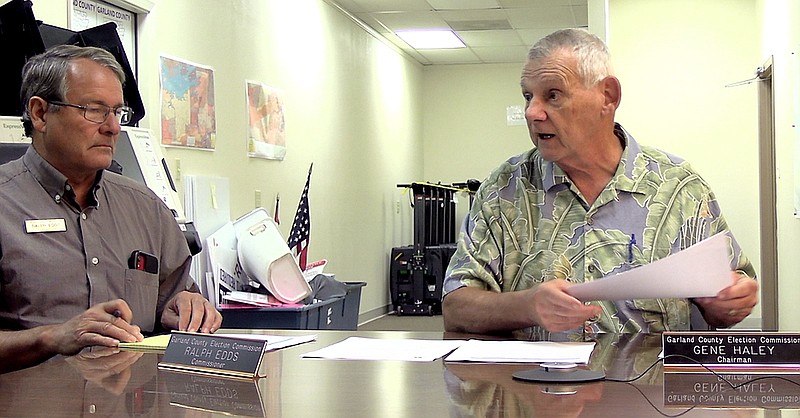 Garland County election commissioners Ralph Edds, left, and Gene Haley discuss the May 24 elections Friday at the Election Commission Building. - Photo by Andrew Mobley of The Sentinel-Record