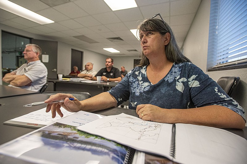 Veronica Robins, the new emergency management director for Crawford County, listens on Wednesday, June 8, 2022, at a meeting with the Arkansas Natural Resources Commission regarding the Frog Bayou Watershed at the Crawford County Emergency Operations Center in Van Buren. Robins served in the position on an interim basis before officially being hired by Crawford County Judge Dennis Gilstrap on May 23. Visit nwaonline.com/220610Daily/ for today's photo gallery.
(NWA Democrat-Gazette/Hank Layton)