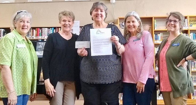 Submitted Photo
Karen Benson, director of the Gravette Public Library, (center) displays the $500 check and an award letter for the $4,000 grant given by the Bentonville/Bella Vista Chapter of Altrusa International in support of the library's summer reading program. The Altrusa chapter has been supporting the library with donations for the last several years. Pictured with Benson are Altrusa members Gay Kiker, Gail Cowdin and Karen McAuley and library clerk Brittany Mangold. Registration for the children's summer reading program begins Thursday, June 16.