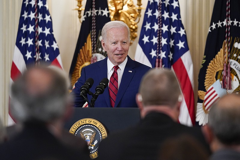 President Joe Biden speaks before signing into law nine bipartisan bills that will honor and improve care for America's veterans during an event in the State Dining room of the White House in Washington, Tuesday, June 7, 2022. (AP Photo/Susan Walsh)