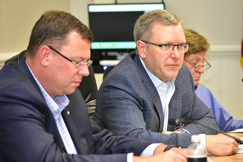 Scott Pittillo (left), chairman of the Jefferson Hospital Association, listens to a presentation by Jefferson Regional CEO Brian Thomas to the Jefferson County Quorum Court Finance Committee on Tuesday, June 7, 2022, at the county courthouse. (Pine Bluff Commercial/I.C. Murrell)