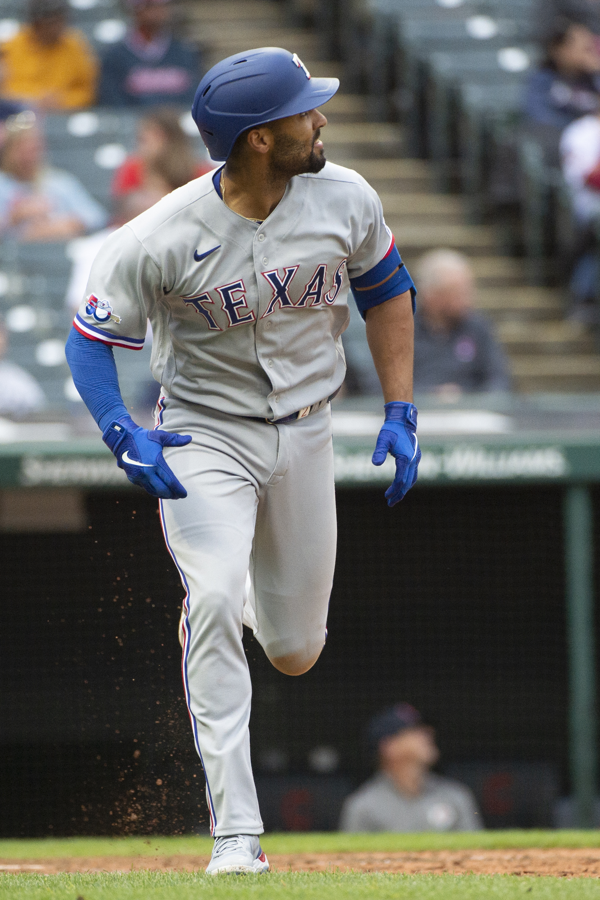 Texas Rangers' Corey Seager, left, greets Marcus Semien after his solo home  run off Cleveland Guardians starting pitcher Kirk McCarty during the third  inning of the second game of a baseball doubleheader