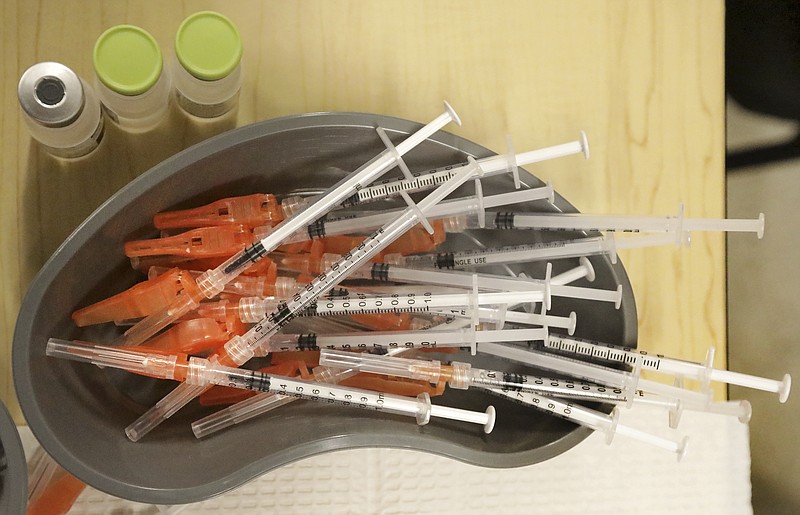 The Associated Press/File photo
Pre-loaded syringes with COVID-19 vaccine are ready as medical staff vaccinate students at KIPP Believe Charter School in New Orleans on Jan. 25.