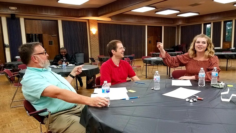 Texarkana College team members Joe Stark, left, and Madeleine Russell, right, point to Jesse Hausler, giving him credit for the team's win in the Literacy Council of Miller and Bowie Counties' annual Spelling Bee on Saturday, May 9, 2021, at Texarkana College in Texarkana, Texas. TC took home the traveling Bee trophy by correctly spelling "lycanthrope" in the 27th round. The 2022 Spelling Bee will be Saturday, July 23 at the college. (Gazette file photo)