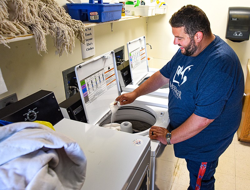 Salvation Army Center of Hope Director Brian Vogeler is once again able to do laundry at the shelter after Lowe's replaced two wash machines purchased last year. Both machines had problems and when trying to get the work done under warranty failed, Lowe's of Jefferson City replaced the pair. (Julie Smith/News Tribune photo)