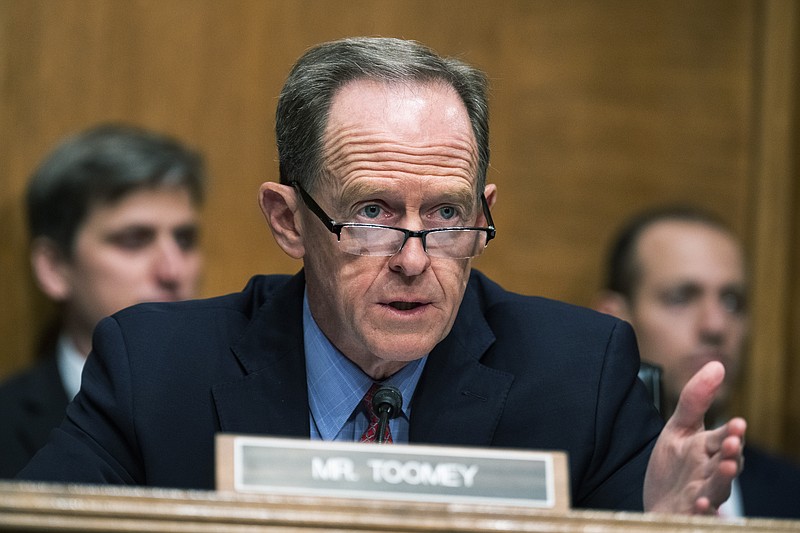 FILE - Ranking member Sen. Pat Toomey, R-Pa., speaks during a Senate Banking, Housing, and Urban Affairs Committee hearing, Tuesday, May 10, 2022, on Capitol Hill in Washington. After the latest cryptocurrency implosion, Washington appears ready to take its first steps to regulate the industry. Toomey is circulating a bill focused on regulating stablecoins, which would require stablecoin providers to have a license to operate, restrict the types of assets they carry to back those stablecoins, as well as be subject to routine auditing to make sure they are complying. (Tom Williams/Pool Photo via AP, File)