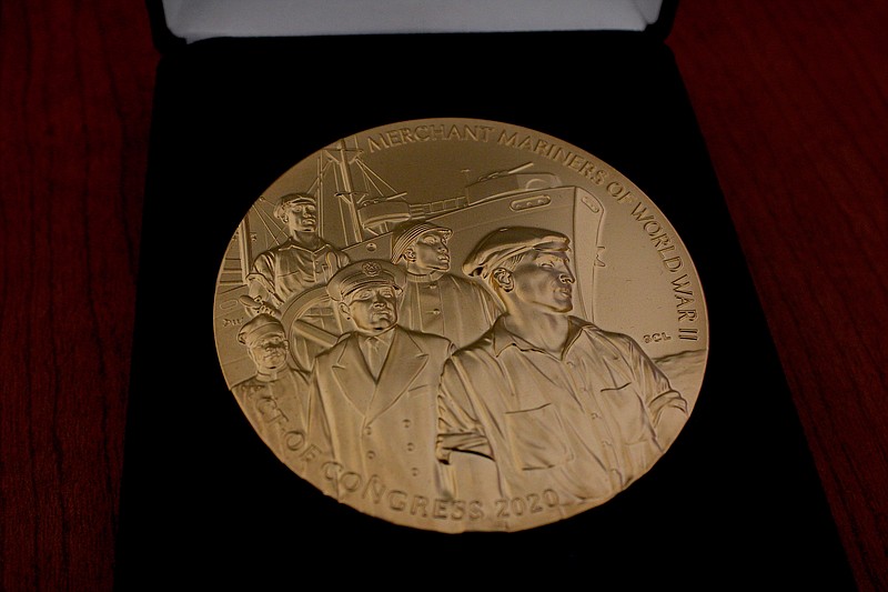 The front side of Bob Ross' Congressional Gold Medal is seen. (Caitlan Butler/News-Times)