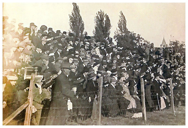 Fayetteville, 1910: To watch the Hogs play 112 years ago, fans crowded low bleachers behind a wire fence on the edge of a field.