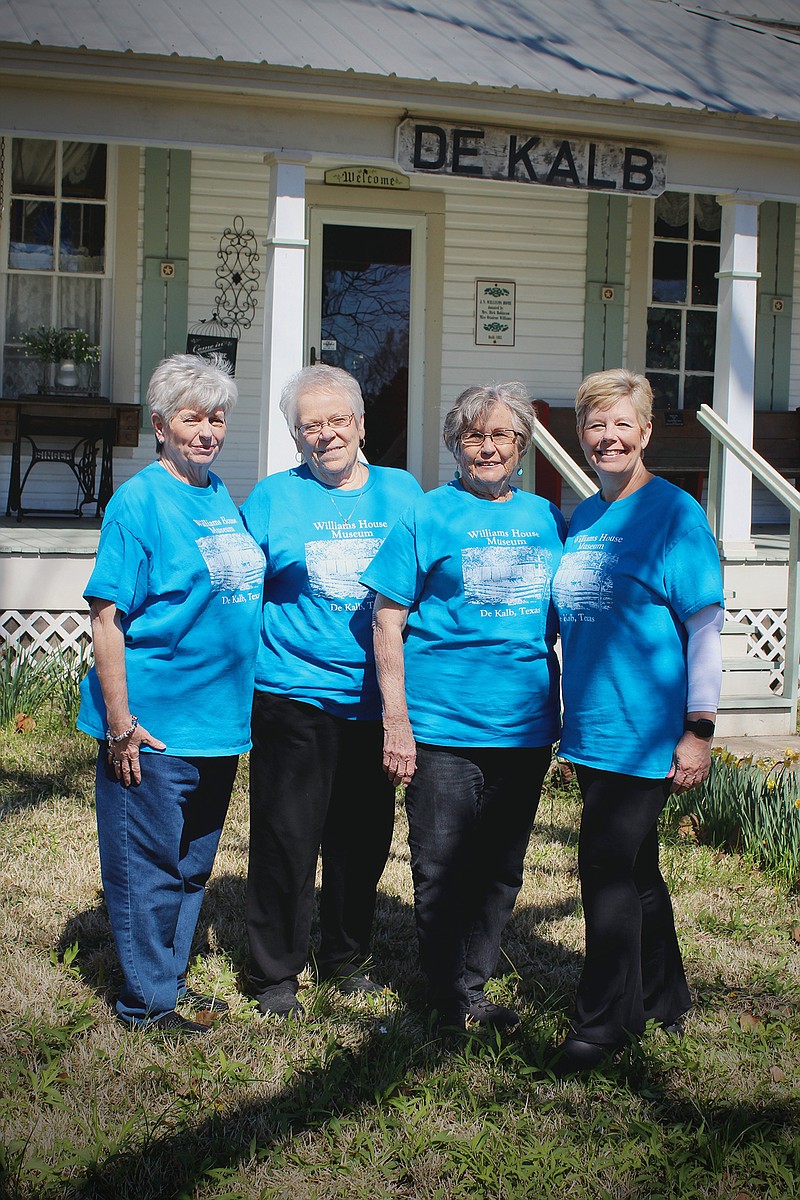 Deb Wilson, Linda Shumake, Carolyn McCrary, and Denise Swint pose outside of the Williams House Museum in DeKalb, Texas. (Photo by Katie Stone)