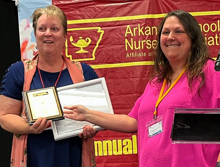 Westside Eagle Observer/LONNIE MOLL
Mary Bailey, R.N., district nurse in the Gentry School District, received the R.N. school nurse of the year award on June 8 at the Arkansas School Nurse Association Conference in Conway. The award was presented by Amy Fortner, president of the Arkansas School Nurse Association.