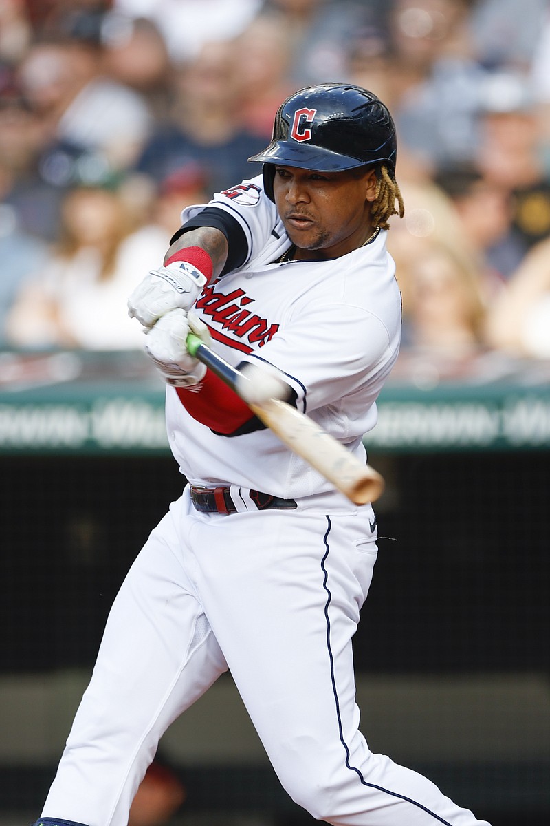 Cleveland Guardians' José Ramírez hits a double against the Oakland Athletics during the first inning of a baseball game, Friday, June 10, 2022, in Cleveland. (AP Photo/Ron Schwane)