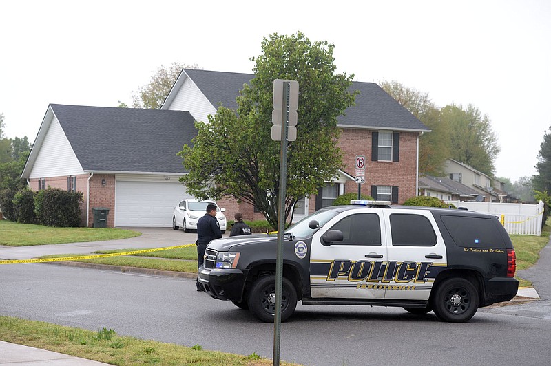 Fayetteville Police Department officials collect evidence Thursday, April 29, 2021, at 702 Daisy Lane after responding to a shooting report. The department is applying for a federal grant that would help create a violent crime response unit.
(File photo/NWA Democrat-Gazette/Andy Shupe)