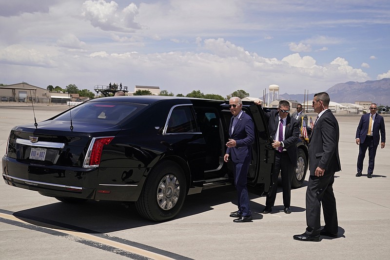 President Joe Biden pauses before getting into the presidential limousine at Kirtland Air Force Base during a trip to meet with state and local officials on the New Mexico wildfires, Saturday, June 11, 2022, in Albuquerque, N.M. (AP Photo/Evan Vucci)