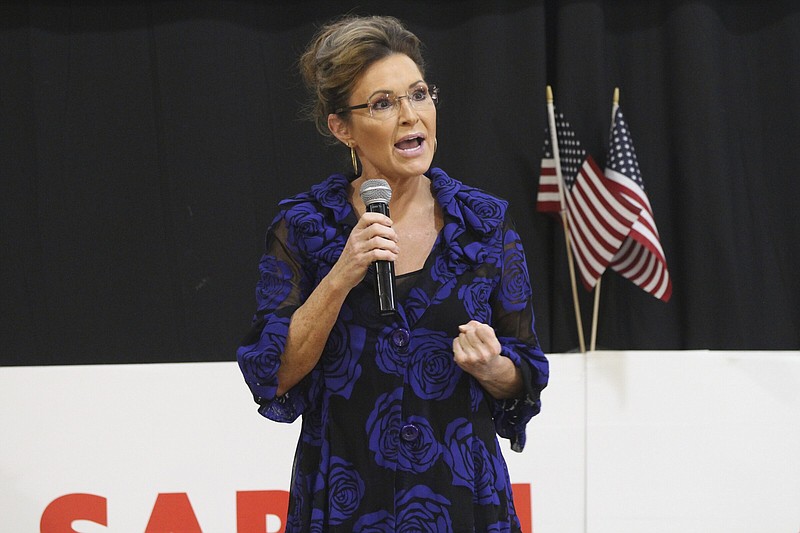 Sarah Palin, a Republican seeking the sole U.S. House seat in Alaska, addresses supporters Thursday, June 2, 2022, in Anchorage, Alaska, during an event that featured former President Donald Trump whose voice was heard over loudspeakers in a church gym. Palin is one of 48 candidates seeking to replace the late U.S. Rep. Don Young who died in March. The top four vote-getters from the June 11 special primary advance to the special election for the seat in August, where ranked choice voting will be used. (AP Photo/Mark Thiessen)