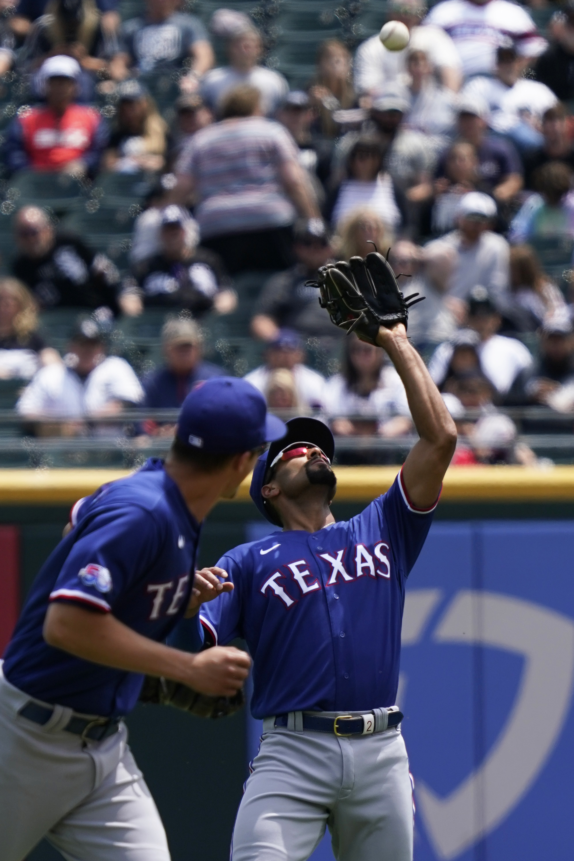 Texas Rangers' Ezequiel Duran, left, is caught stealing second