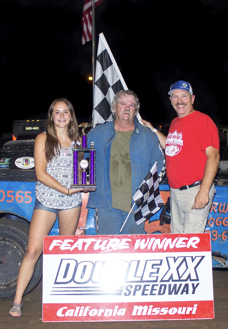 Submitted
Tuscumbia's Dale Berry accepts the winning Super Stock feature trophy from Double-X Speedway trophy girl Ellye Messerli and Director of Competition Brad Friedmeyer both of California.